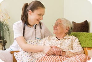 Doctor visiting an elderly woman.